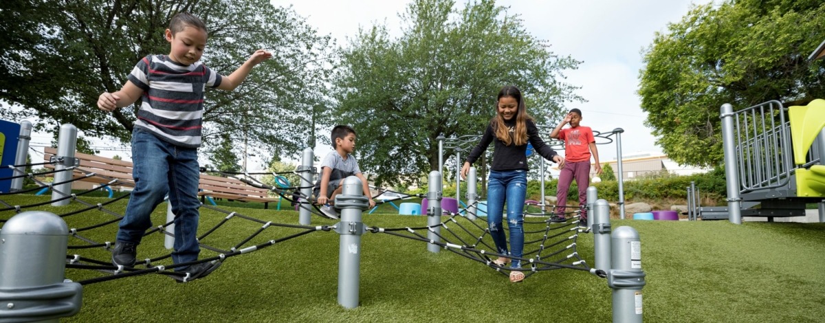 Children Playing on Playground Equipment
